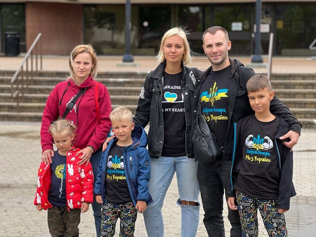 Oleksndr with his wife and boys on the right, next to his sister and niece (wearing red jackets)